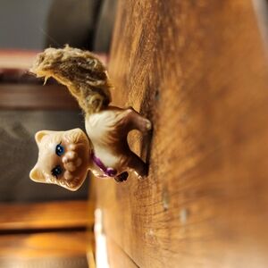 Adorable Tan Cat Toy with Purple Collar